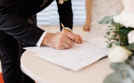 couple-love-is-signing-official-marriage-documents_8353-10977.jpg
